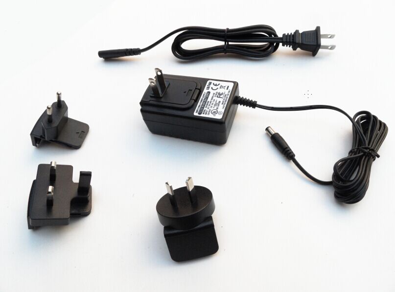 AC power adapter 9.5V 1A with exchangeable plugs